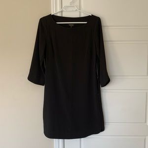 Black 3/4 sleeve dress with side zip.